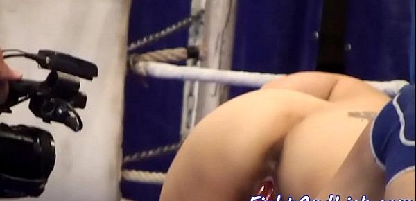  Asian lesbian rides strapon in a boxing ring
